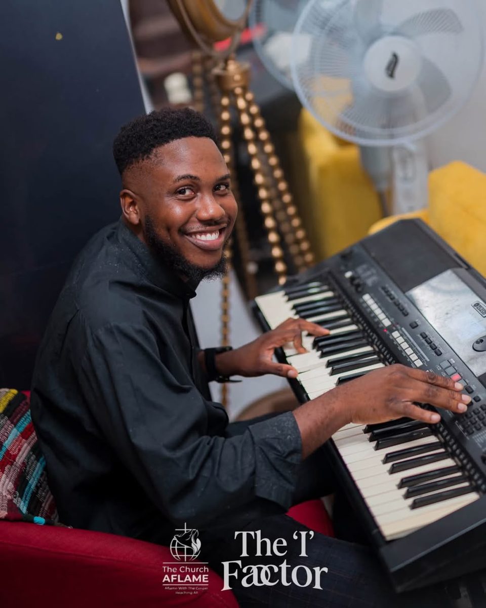 Keyboardist smiling while leading worship