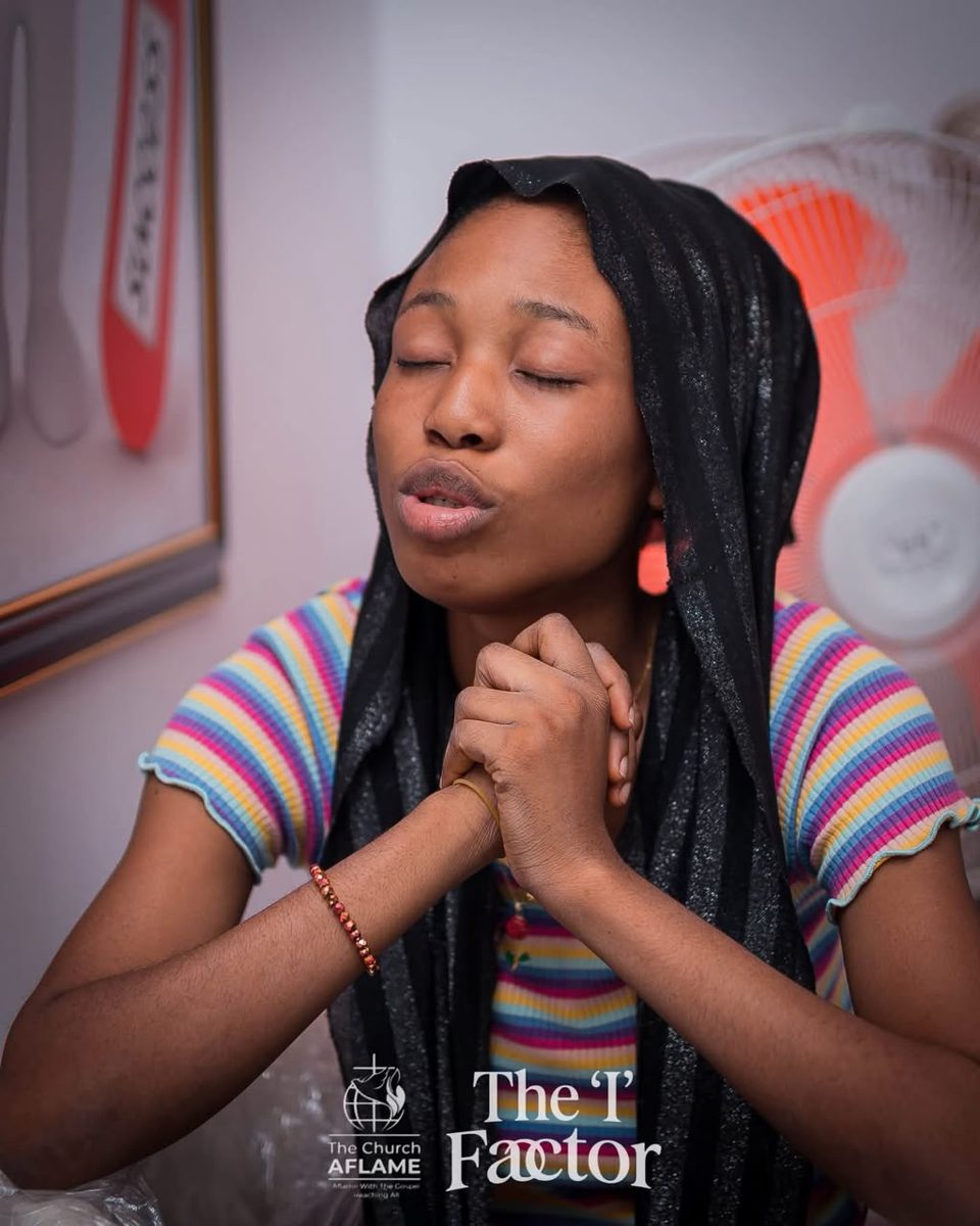 Sister worshipping with a covered head