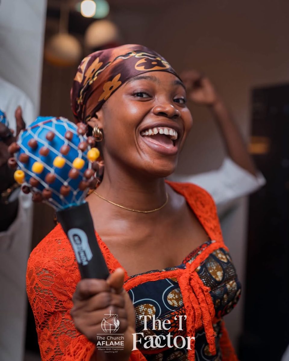 Sister rejoicing with a shaker in hand